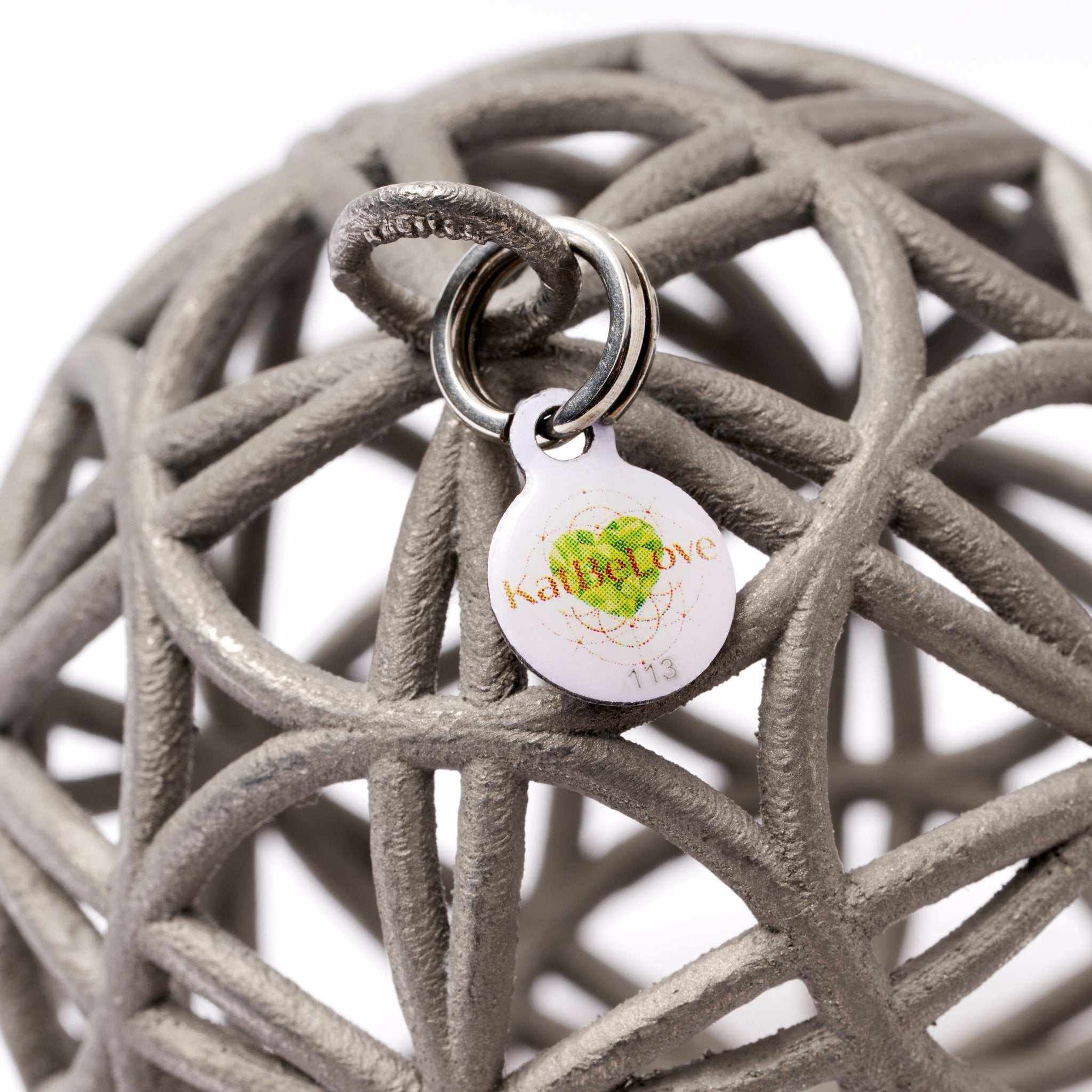 Intricate 3D sacred geometry talisman Love Sphere necklace in polished stainless steel representing love and unity